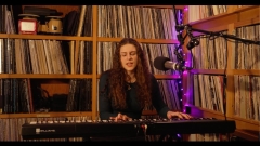 Marina Prikis playing a keyboard and singing in the WRMC studio